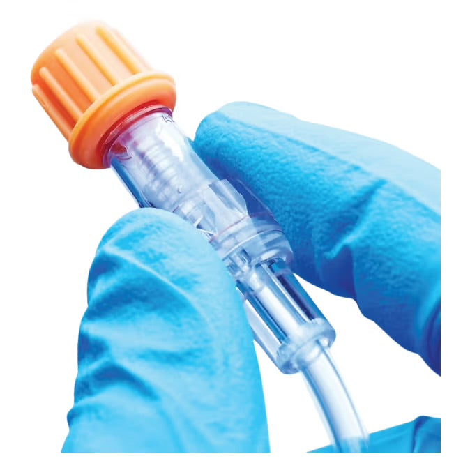 ICU Medical SwabCap being twisted onto luer-lock needlefree connector showing red IPA indicator seal
