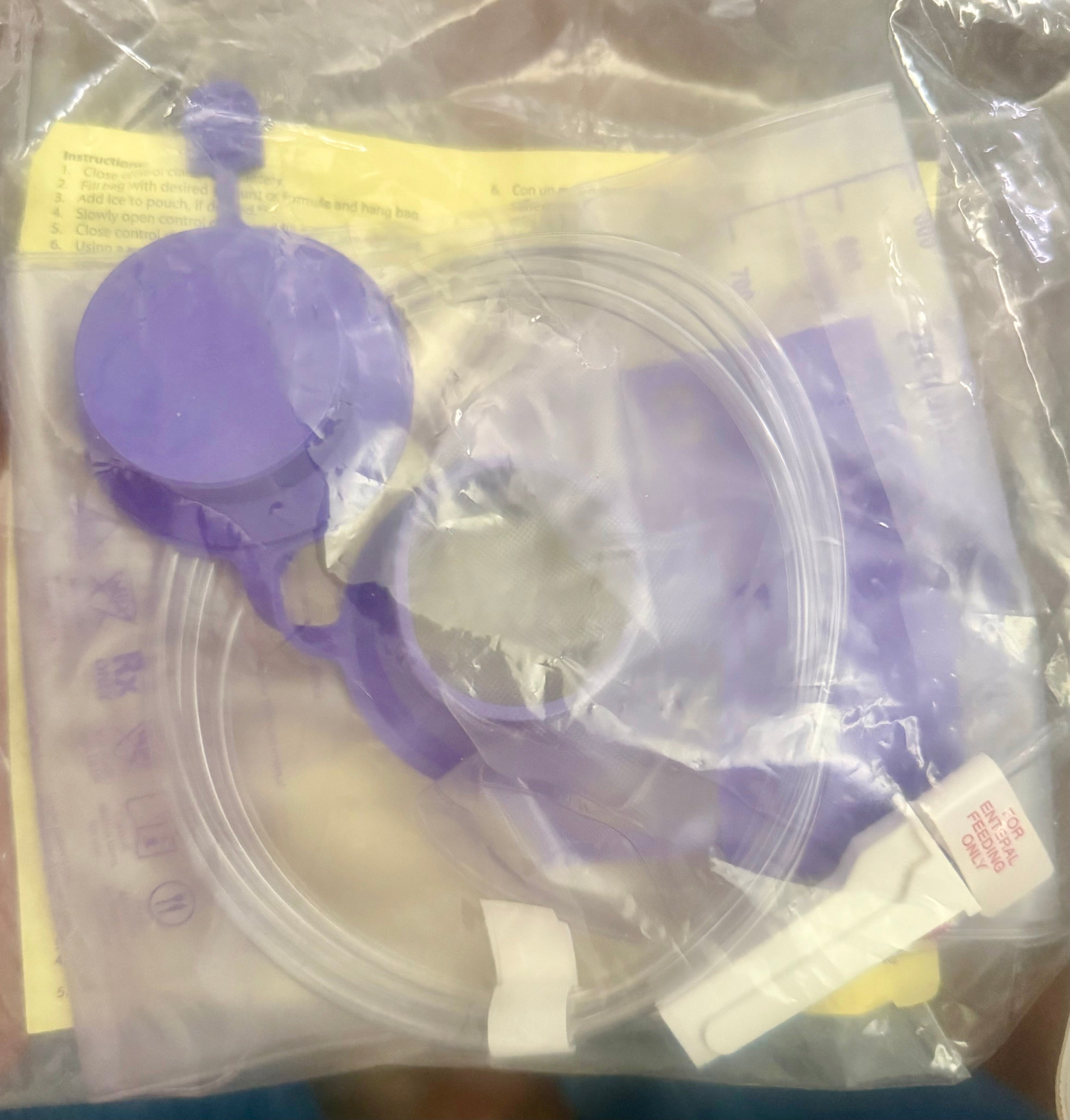 Covidien Kangaroo Gravity Feeding Bag 1000mL — purple ENfit tubing set and bag components in sterile packaging