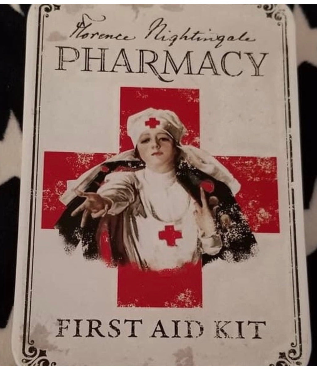 Florence Nightingale Pharmacy vintage first aid kit tin — medical collectible