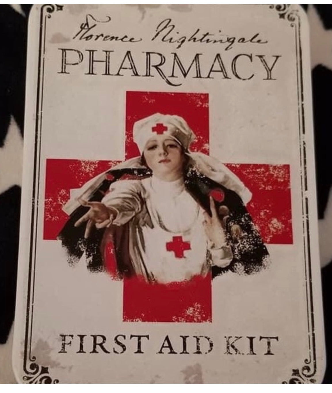 Florence Nightingale Pharmacy vintage first aid kit tin — medical collectible