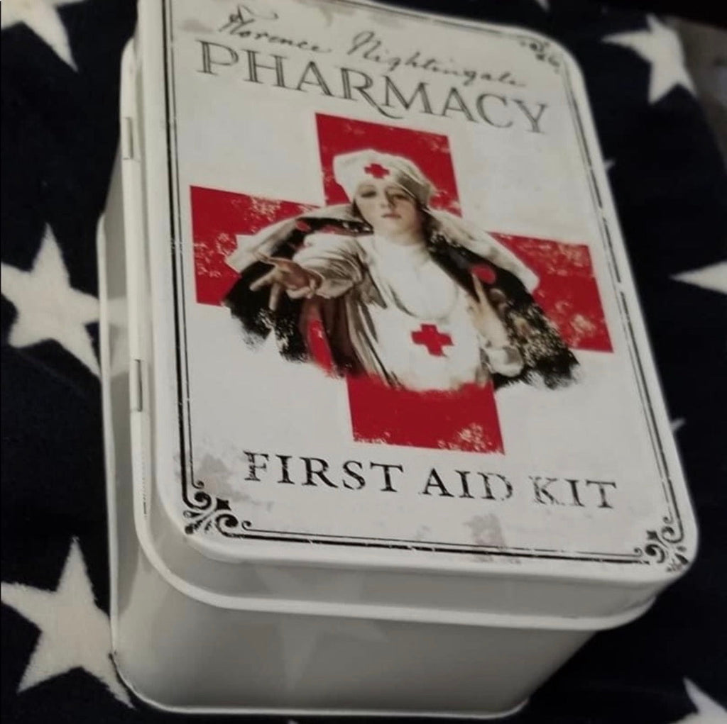 Florence Nightingale Pharmacy First Aid Kit tin — 3D view showing hinged metal tin with vintage label on lid